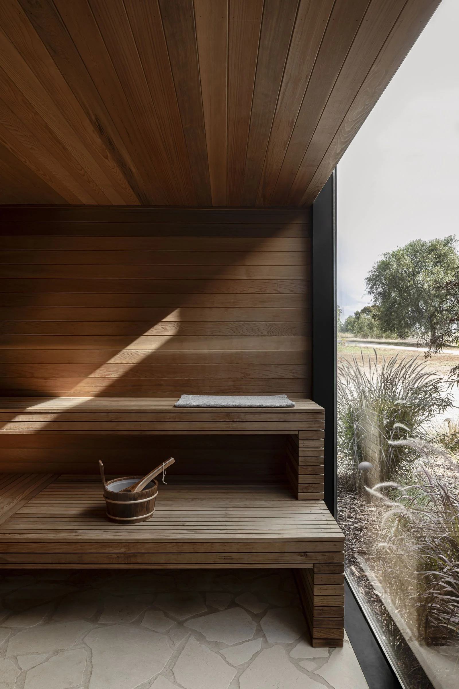 Zensi Retreat — cedar sauna with views to the paddock